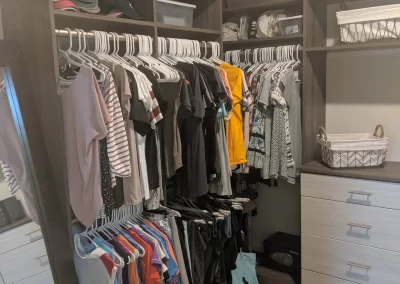 Custom Walk-in Closet Storage System With Additional Storage On Top