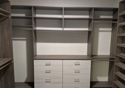 Custom Closet Shelving In Hudson Cherry With Drawers and Hanging Space